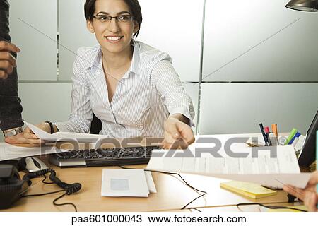 Businesswoman working in office View Large Photo Image Stock Image - Businesswoman working in office. Fotosearch