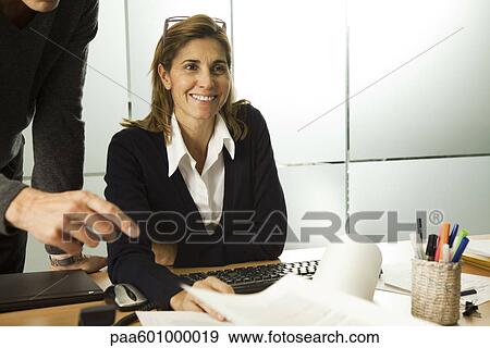Businesswoman working in office View Large Photo Image Stock Photo - Businesswoman working in office. Fotosearch