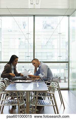 Colleagues discussing work View Large Photo Image Stock Photography - Colleagues discussing work. Fotosearch
