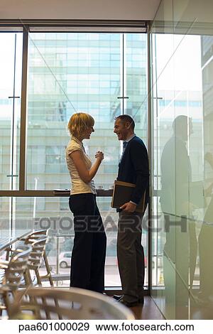 Colleagues talking cheerfully View Large Photo Image Stock Photo - Colleagues talking cheerfully. Fotosearch