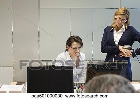 Colleagues working together View Large Photo Image Stock Image - Colleagues working together. Fotosearch
