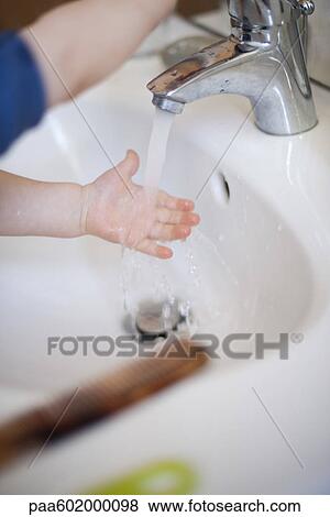 Child washing hands in sink View Large Photo Image Stock Photo - Child washing hands in sink. Fotosearch
