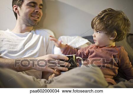 Father bonding with toddler son View Large Photo Image Picture - Father bonding with toddler son. Fotosearch
