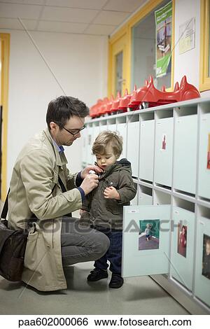 Stock Photograph - Father dropping toddler son off at preschool. Fotosearch