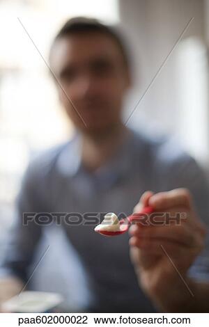 Person holding out spoonful of food, personal perspective View Large Photo Image Stock Image - Person holding out spoonful of food, personal perspective. Fotosearch