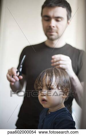 Picture - Toddler boy having his hair cut. Fotosearch