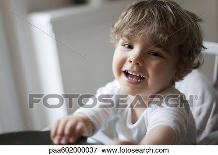 Toddler boy smiling, portrait View Large Photo Image Stock Photo - Toddler boy smiling, portrait. Fotosearch
