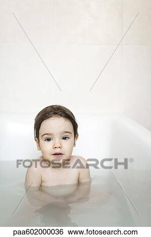 Toddler boy taking a bath, portrait View Large Photo Image Stock Photograph - Toddler boy taking a bath, portrait. Fotosearch
