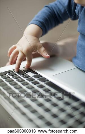 Child's hand touching laptop keyboard View Large Photo Image Stock Image - Child's hand touching laptop keyboard. Fotosearch
