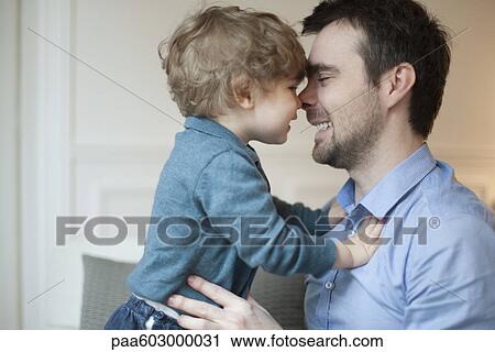 Father and toddler son nuzzling View Large Photo Image Stock Image - Father and toddler son nuzzling. Fotosearch