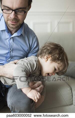 Stock Image - Father and toddler son playing. Fotosearch