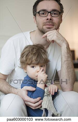 Father and toddler son, portrait View Large Photo Image Stock Image - Father and toddler son, portrait. Fotosearch