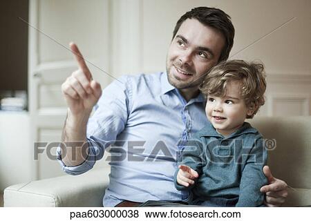 Father and young son, portrait View Large Photo Image Stock Photo - Father and young son, portrait. Fotosearch