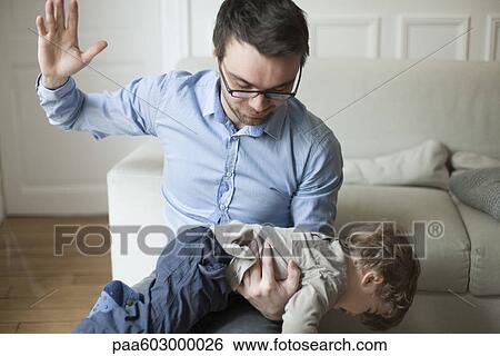 Father disciplining toddler View Large Photo Image Stock Photograph - Father disciplining toddler. Fotosearch