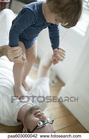 Father playing with toddler boy View Large Photo Image Stock Image - Father playing with toddler boy. Fotosearch