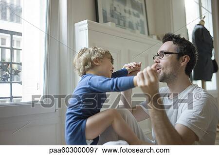 Father playing with toddler son View Large Photo Image Stock Photo - Father playing with toddler son. Fotosearch