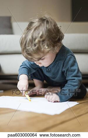 Toddler boy drawing on paper View Large Photo Image Picture - Toddler boy drawing on paper. Fotosearch