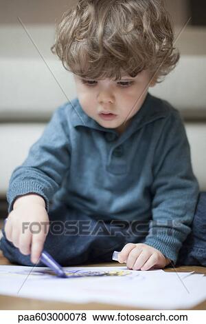 Toddler boy sitting on floor, drawing on paper View Large Photo Image Stock Photo - Toddler boy sitting on floor, drawing on paper. Fotosearch