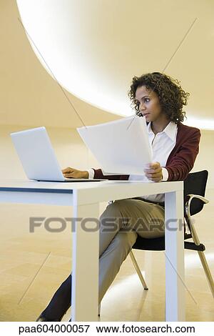 Stock Photo - Businesswoman using laptop. Fotosearch