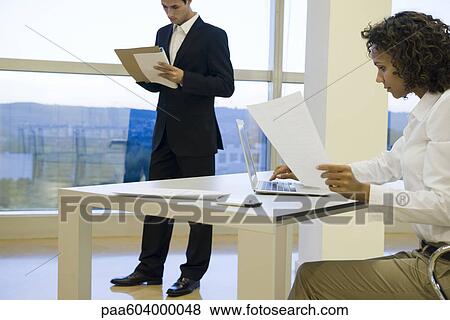 Executive working on laptop computer View Large Photo Image Stock Photo - Executive working on laptop computer. Fotosearch