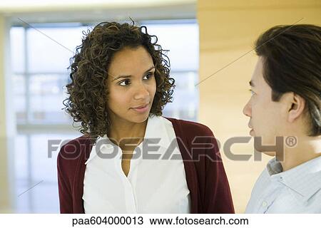 Executives having conversation View Large Photo Image Stock Image - Executives having conversation. Fotosearch