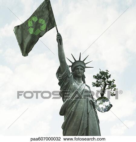 Statue of liberty raising flag with recycling symbol while holding earth in the other arm View Large Photo Image Stock Image - Statue of liberty raising flag with recycling symbol while holding earth in the other arm. Fotosearch