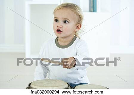 Baby boy playing drums View Large Photo Image Picture - Baby boy playing drums. Fotosearch