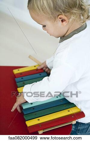 Baby boy with toy xylophone View Large Photo Image Stock Photo - Baby boy with toy xylophone. Fotosearch
