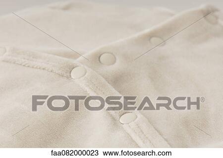 Baby clothing, close-up View Large Photo Image Stock Image - Baby clothing, close-up. Fotosearch