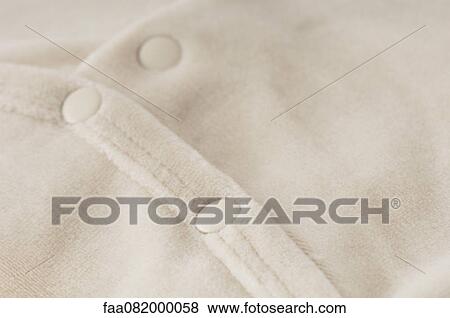 Baby clothing, close-up View Large Photo Image Stock Photo - Baby clothing, close-up. Fotosearch