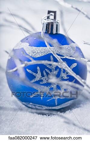 Blue bauble in snow View Large Photo Image Stock Photo - Blue bauble in snow. Fotosearch