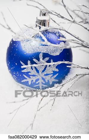 Blue bauble in snow View Large Photo Image Stock Photo - Blue bauble in snow. Fotosearch