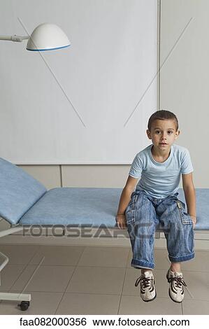 Boy waiting in doctor's office View Large Photo Image Stock Photograph - Boy waiting in doctor's office. Fotosearch