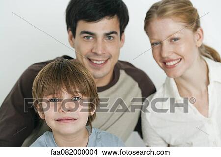 Boy with parents, focus on foreground View Large Photo Image Picture - Boy with parents, focus on foreground. Fotosearch