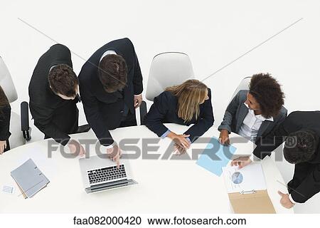 Business associates collaborating on project View Large Photo Image Stock Image - Business associates collaborating on project. Fotosearch
