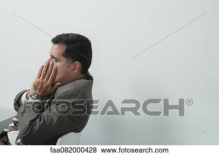 Businessman covering face with hands View Large Photo Image Stock Photo - Businessman covering face with hands. Fotosearch