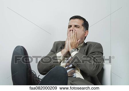 Businessman yawning View Large Photo Image Stock Photo - Businessman yawning. Fotosearch
