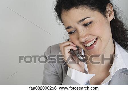 Businesswoman talking on cell phone View Large Photo Image Stock Photograph - Businesswoman talking on cell phone. Fotosearch