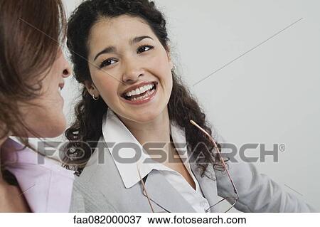 Businesswomen chatting View Large Photo Image Stock Photo - Businesswomen chatting. Fotosearch