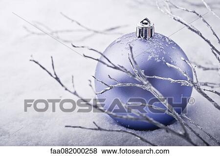 Christmas bauble in snow View Large Photo Image Stock Photo - Christmas bauble in snow. Fotosearch