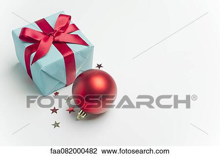Stock Image - Christmas present and ornament. Fotosearch