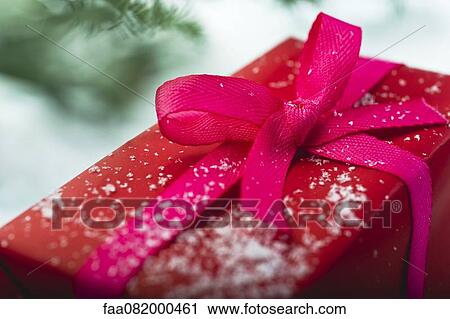 Christmas present covered in snowflakes View Large Photo Image Stock Image - Christmas present covered in snowflakes. Fotosearch