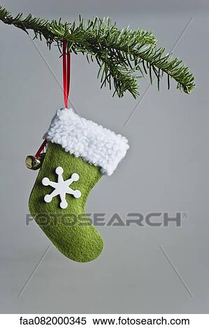 Christmas stocking ornament hanging on branch View Large Photo Image Stock Photography - Christmas stocking ornament hanging on branch. Fotosearch