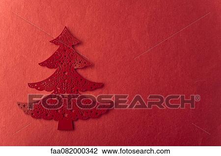 Christmas tree shape on red background View Large Photo Image Stock Image - Christmas tree shape on red background. Fotosearch