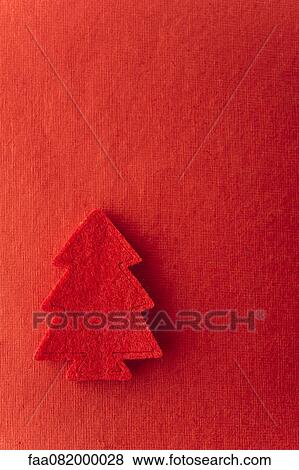 Stock Photo - Christmas tree shape on red background. Fotosearch