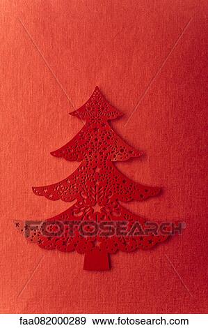 Stock Photo - Christmas tree shape on red background. Fotosearch