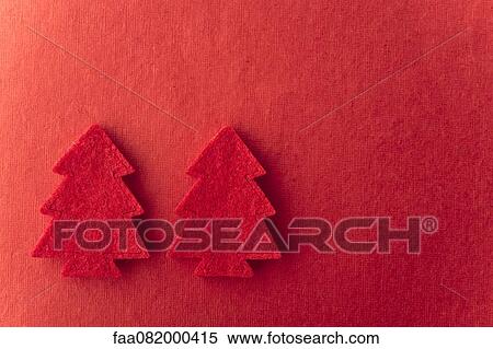 Christmas tree shapes on red background View Large Photo Image Stock Photography - Christmas tree shapes on red background. Fotosearch