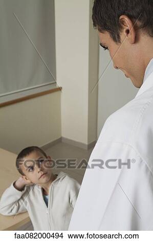Picture - Doctor with little boy. Fotosearch