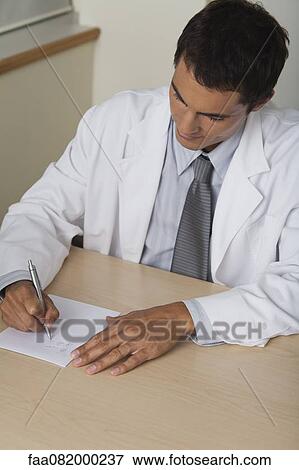 Doctor writing prescription View Large Photo Image Stock Photo - Doctor writing prescription. Fotosearch