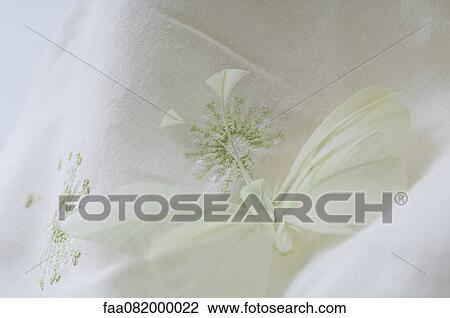 Fake butterfly resting on embroidered fabric View Large Photo Image Stock Image - Fake butterfly resting on embroidered fabric. Fotosearch